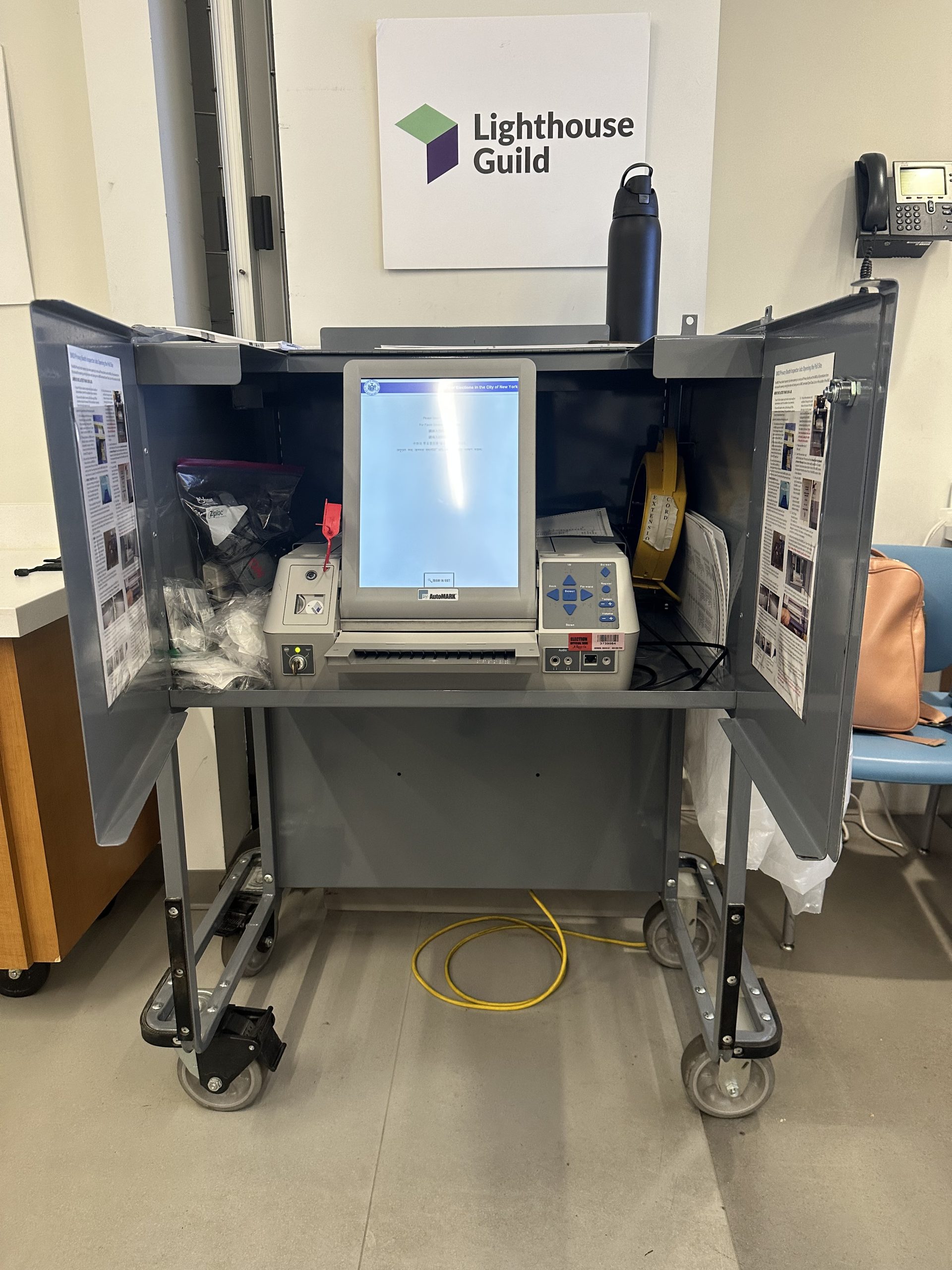 BMD machine -Ballot Marking Device Voter Booth that has privacy walls on each side and a touch screen and headphones